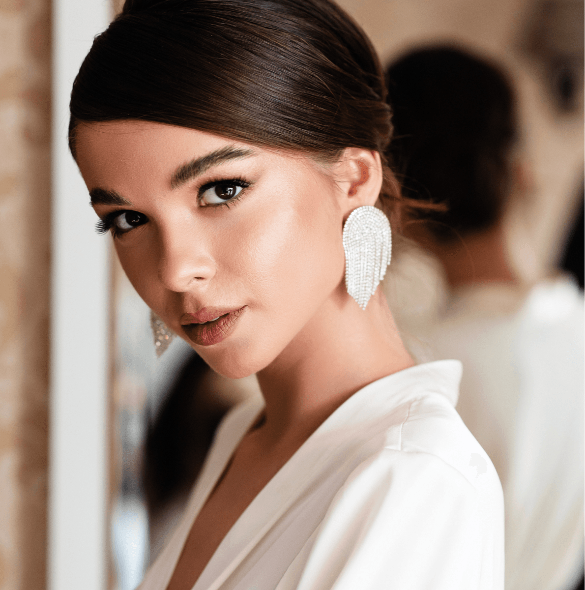 princeton med spa model wearing silver earrings