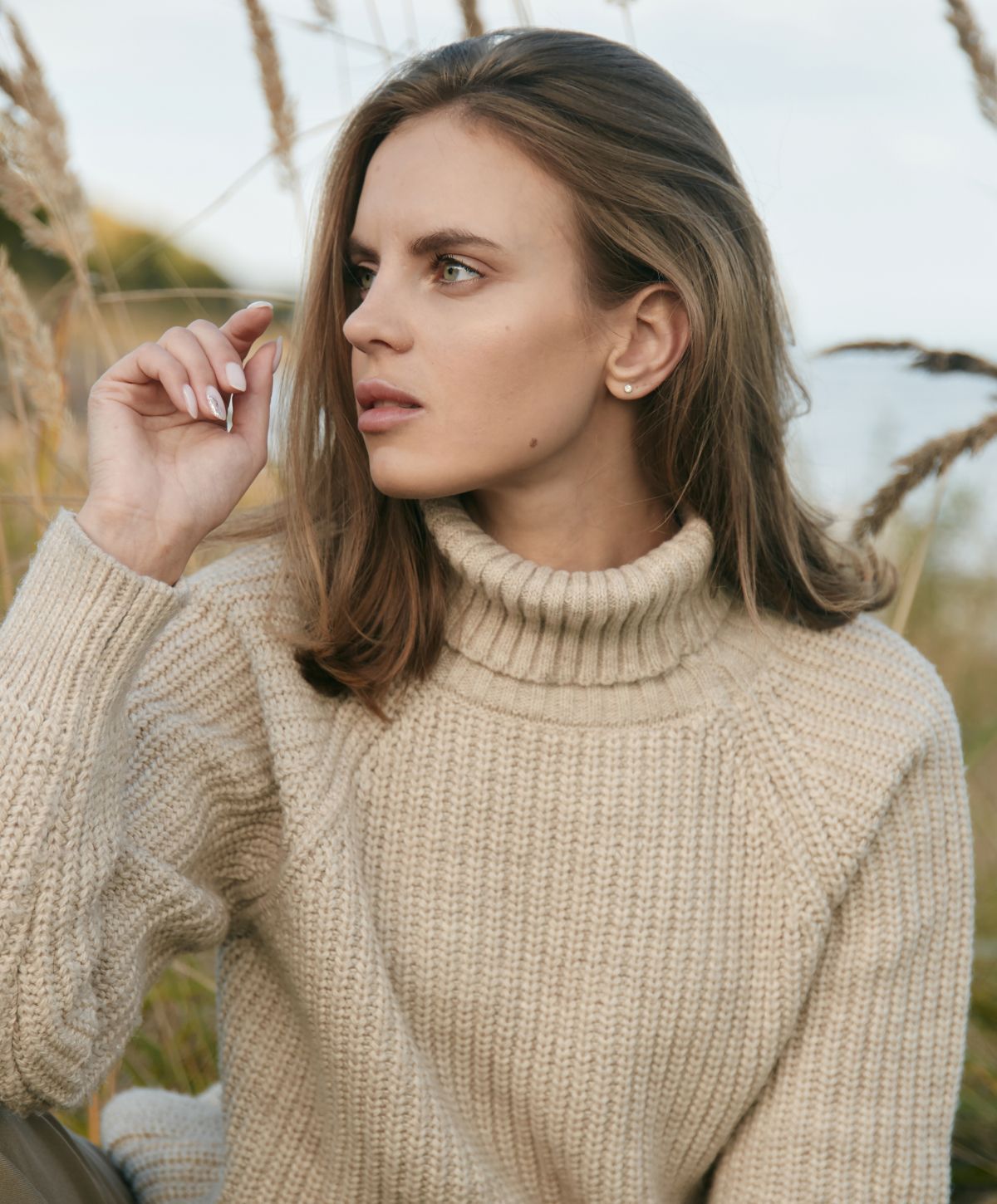 princeton scar treatment model wearing a beige sweater