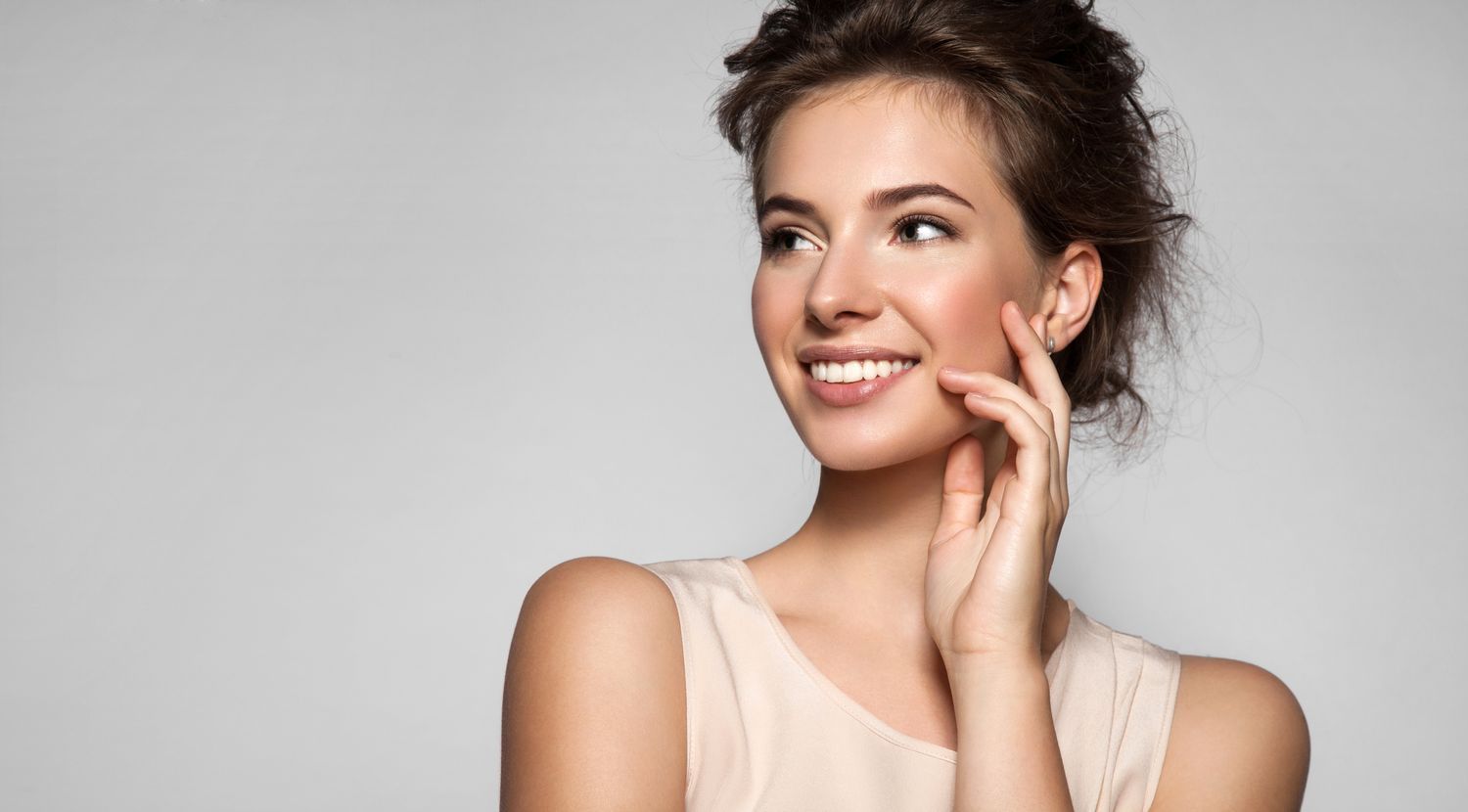princeton med spa model wearing a beige sweater